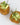 A photo of Mini tuna patties topped with avocado salsa and chives. Perfect for events of all sizes.