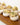 A photo of Button mushrooms filled with bacon, spring onions, garlic, mozzarella, egg and breadcrumbs. 