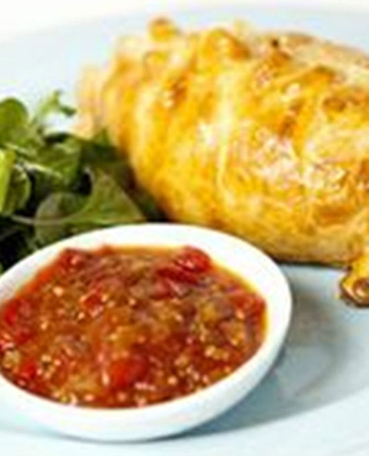 A photo of a pasties contain a small amount of beef mince, lots of potato, onion and a small amount of carrot. 